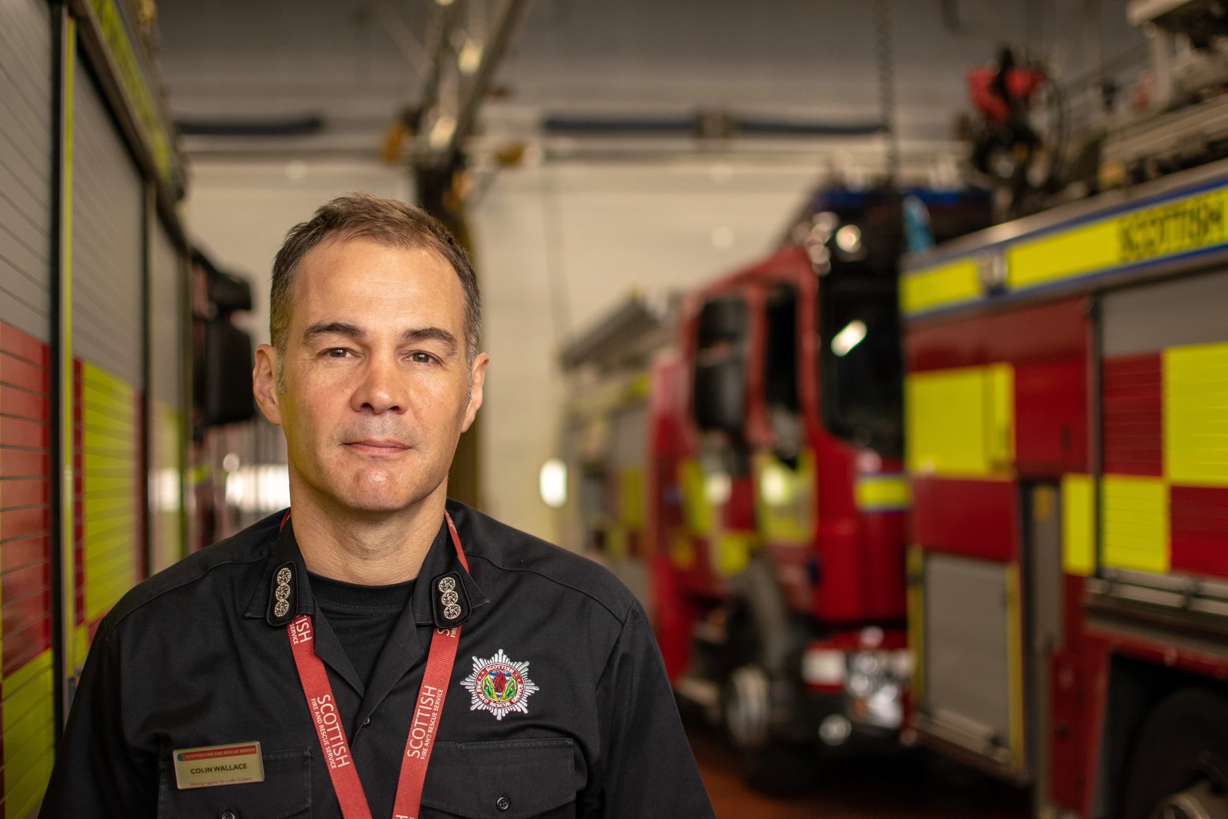 Environmental portrait of a man inside a fire station